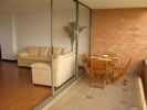 Furnished Medellin Apartment with beautiful balcony view of green mountains and trees - Perfect balcony for a romatic dinner date with your Colombian girlfirend, or spouse!