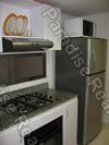 Medellin Envigado Apartment modern kitchen with plates and cooking ware